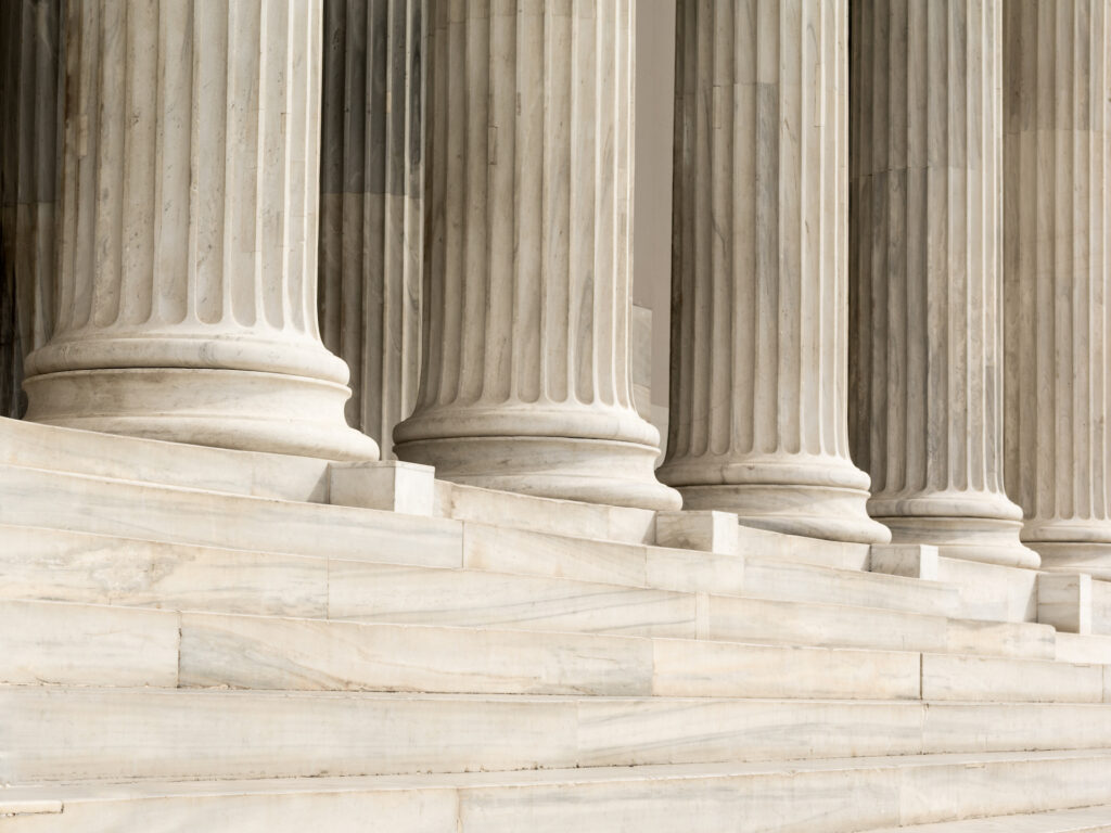 Architectural detail of marble steps and ionic order columns